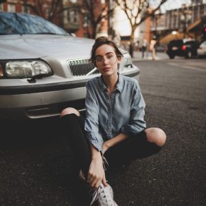 girl in front of car - Personal Casualty Insurance